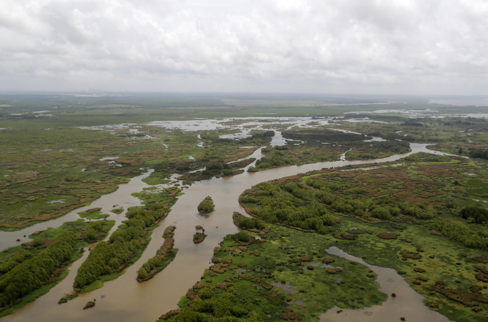 This May 1, 2019, file photo shows the Davis Pond Diversion in St. Charles Parish, La. A nearly $2 billion plan to divert water and sediment from the Mississippi River to rebuild land in southeastern Louisiana, a proposal considered the cornerstone of the state's efforts to protect its rapidly eroding coast, has passed a major milestone with the publication of the Army Corps of Engineers long-awaited environmental impact study, Thursday, March 4, 2021. (AP Photo/Gerald Herbert, File)