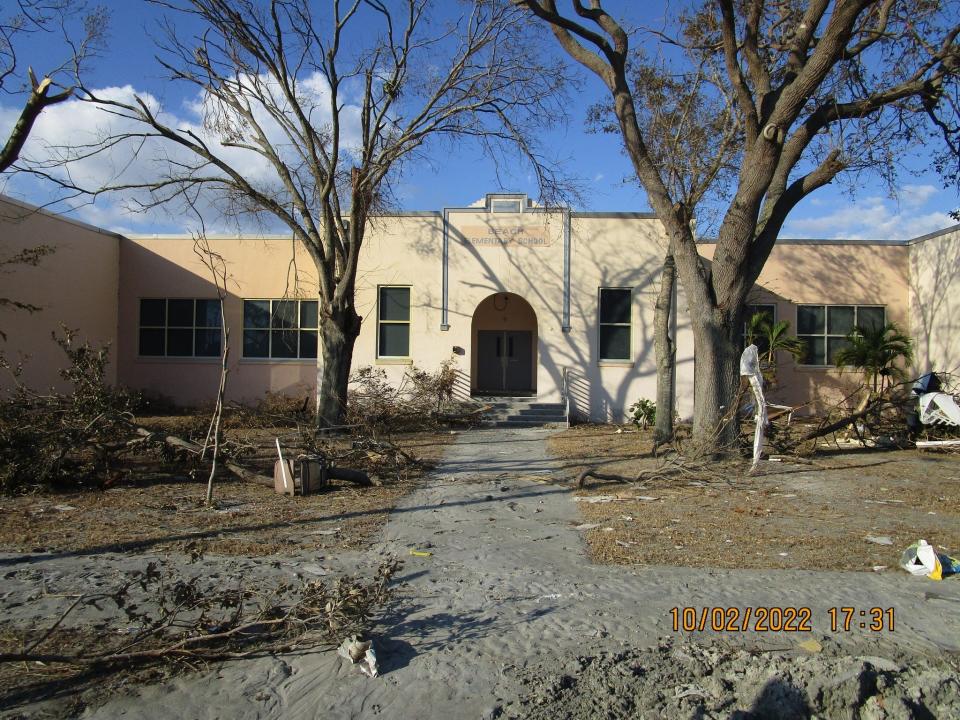 The outside of Fort Myers Beach Elementary covered in debris from Hurricane Ian.