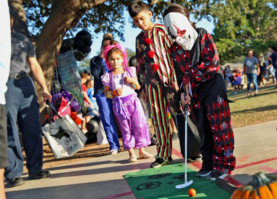 A group of young people attend the Boo Bash Halloween event at Bowie Elementary School on Thursday, Oct. 28, 2021.