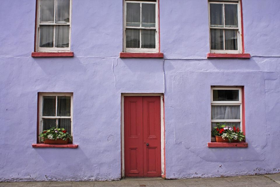 <p>Purple and red are the perfect pairing on a quirky building in Ireland.</p>