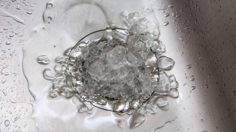 Melting ice cubes in sink drain