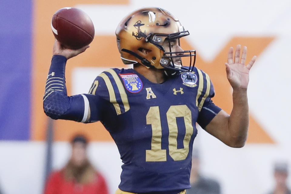 Navy quarterback Malcolm Perry passes against Kansas State in the first half of the Liberty Bowl NCAA college football game Tuesday, Dec. 31, 2019, in Memphis, Tenn. (AP Photo/Mark Humphrey)