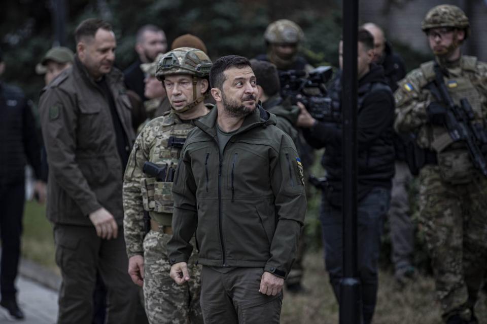 Ukrainian President Volodymyr Zelensky attends a flag hoisting ceremony in Izium after the Ukrainian forces took control of the city from the Russian forces in Kharkiv Oblast on Sept. 14, 2022. Commander of the Ukrainian Land Forces Oleksandr Syrskyi, Head of the Presidential Office Andriy Yermak, Governor of the Military Administration of the Kharkiv Region Oleg Sinegubov also attended the ceremony. (Metin AktaÅ/Anadolu Agency via Getty Images)