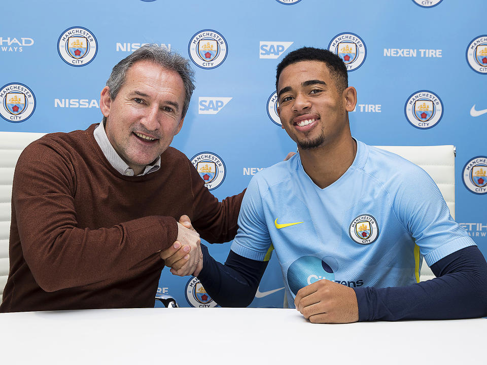 Manchester City chief Txiki Begiristain shakes hands with new signing Gabriel Jesus: PA