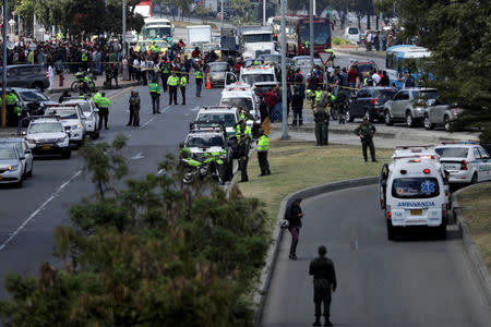 Police and security personnel work at the scene where a car bomb exploded, according to authorities, in Bogota, Colombia January 17, 2019. REUTERS/Luisa Gonzalez