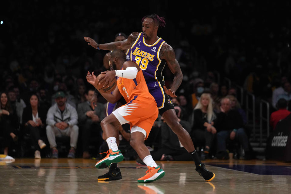 Oct 22, 2021; Los Angeles, California, USA; Phoenix Suns guard Chris Paul (3) is defended by Los Angeles Lakers center Dwight Howard (39) in the first half at Staples Center.