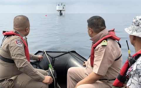 Thai naval officers from the Third Naval Area Command and Marine policemen inspect the 'Seastead'' in the Andaman Sea, - Credit: Rex