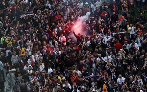 psg fans lighting a flare - Credit: GETTY IMAGES