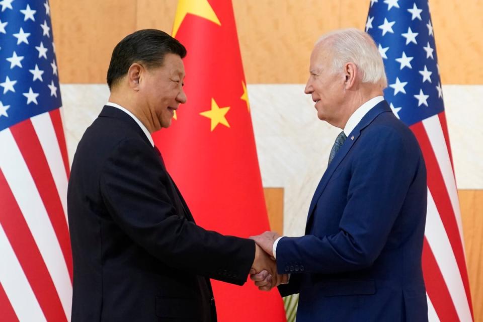 US President Joe Biden, right, and Chinese President Xi Jinping shake hands before their meeting on the sidelines of the G20 summit meeting (AP)