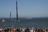 Oracle Team USA crosses the finish line ahead of Emirates Team New Zealand during Race 17 of the 34th America's Cup yacht sailing race in San Francisco, California September 24, 2013. REUTERS/Stephen Lam (UNITED STATES - Tags: SPORT YACHTING)