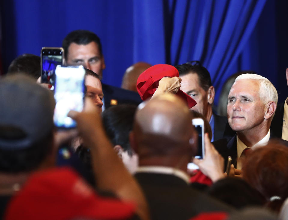 Vice President Mike Pence speaks to constituents after speaking during a rally on Tuesday, June 25, 2019 in Miami. (AP Photo/Brynn Anderson)