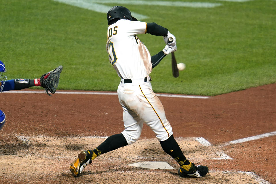 Pittsburgh Pirates' Bryan Reynolds hits a solo home run off Chicago Cubs relief pitcher Manuel Rodriguez during the seventh inning of a baseball game in Pittsburgh, Friday, Sept. 23, 2022. (AP Photo/Gene J. Puskar)