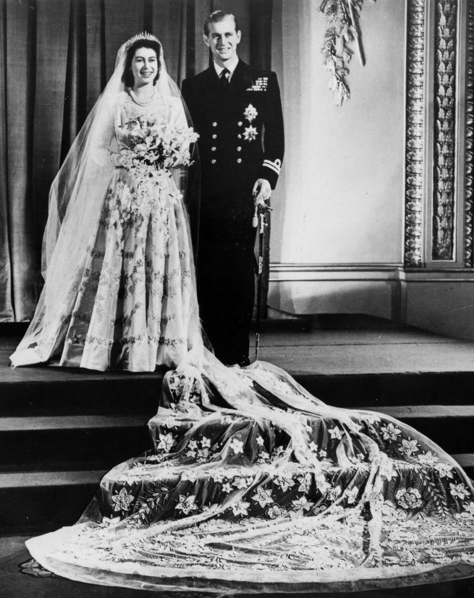 <p>Elizabeth and Philip <a href="https://www.goodhousekeeping.com/beauty/fashion/g4919/queen-elizabeth-wedding-gown/" rel="nofollow noopener" target="_blank" data-ylk="slk:wed in Westminster Abbey;elm:context_link;itc:0;sec:content-canvas" class="link ">wed in Westminster Abbey</a> in front of 2,500 guests, with 200 million more people listening to the ceremony on the radio. </p>