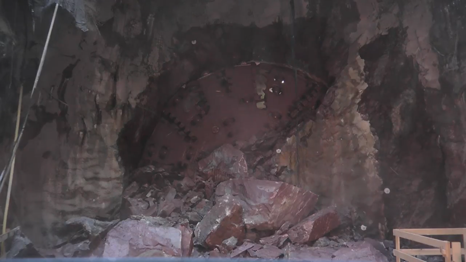 Stone blocks litter the worksite a moment after a tunnel boring machine broke through the last section of bedrock on Thursday to complete a 2.2-mile long tunnel under Pawtucket as part of a project to keep the waters of Narragansett Bay clean.