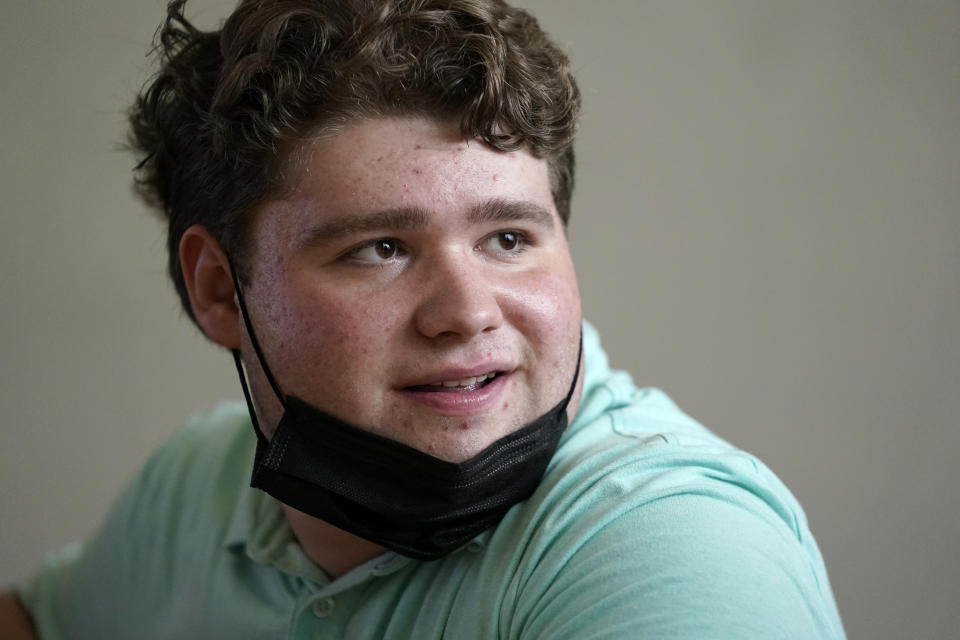 Jake Litvag, 16, prepares to visit a lab at Washington University where doctors are studying a rare form of autism Jake has that is linked to a mutation in the MYT1L gene Wednesday, Dec. 15, 2021, in St. Louis. (AP Photo/Jeff Roberson)