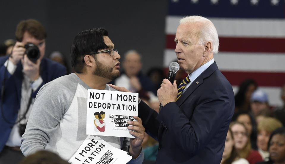 Democratic presidential hopeful Joe Biden talks with a protester objecting to his stance on deportations during a town hall at Lander University in Greenwood, S.C., on Thursday, Nov. 21, 2019. (AP Photo/Meg Kinnard)