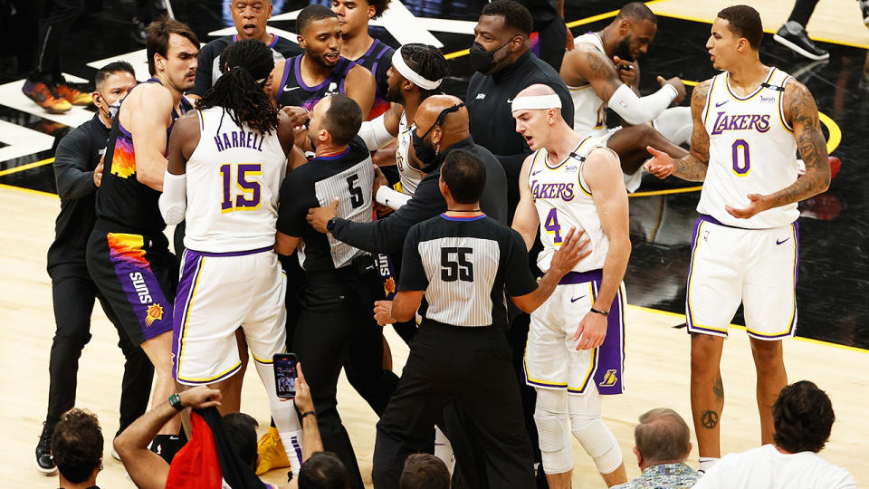 The Lakers and Suns had to be separated early in the fourth quarter of the first match in their NBA playoff series, with Suns guard Cameron Payne getting tossed from the game as a result. (Photo by Christian Petersen/Getty Images)