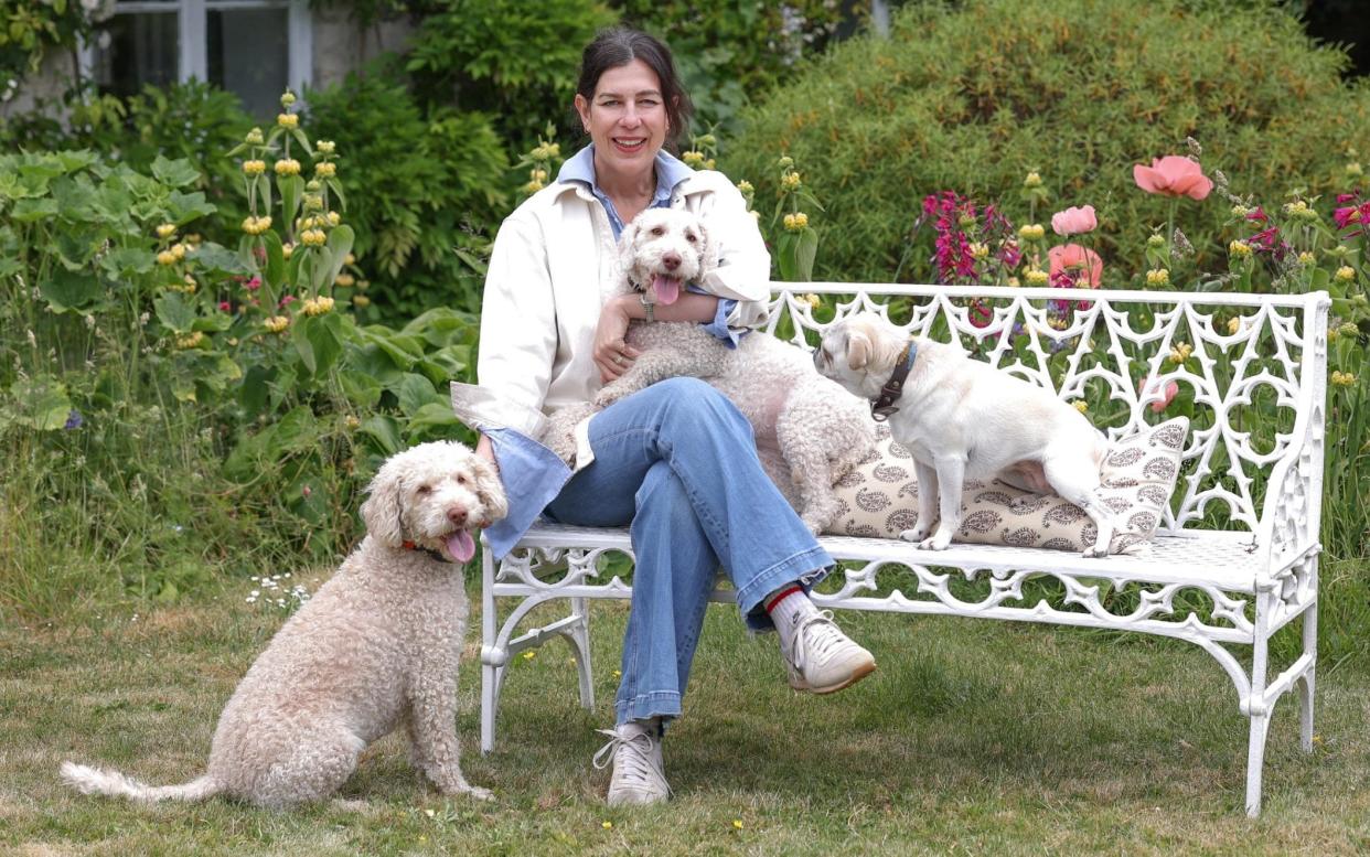 Louise Carpenter with her dogs Margot, Panda and Mog at her home in Somerset - John Lawrence