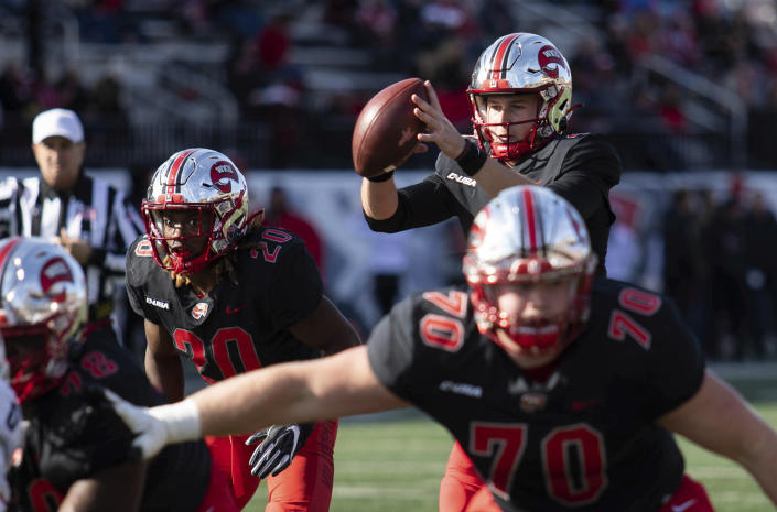 Western Kentucky quarterback Bailey Zappe gets the snap during the team's NCAA college football game against Florida Atlantic in Bowling Green, Ky., Saturday, Nov. 20, 2021. (Grace Ramey/Daily News via AP)