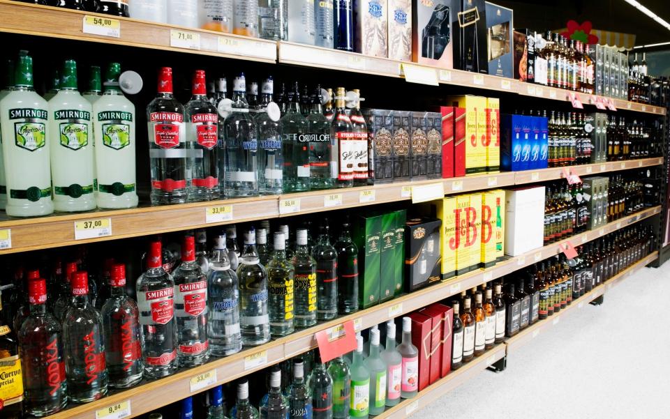 Bottles arranged in a liquor store - Glow Images, Inc/ Getty Images Contributor