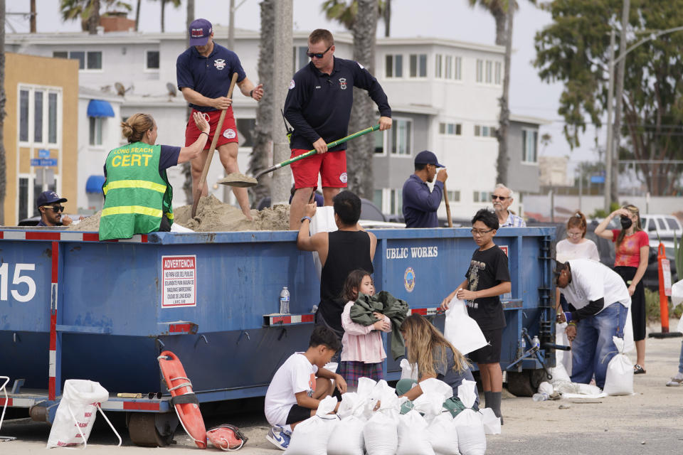 Long Beach Lifeguards fill up sandbags for residents ahead of Hurricane Hilary in Long Beach, Calif., Saturday, Aug. 19, 2023. Hurricane Hilary roared toward Mexico’s Baja California peninsula late Saturday as a downgraded but still dangerous Category 2 hurricane that's likely to bring “catastrophic” flooding to the region and cross into the southwest U.S. as a tropical storm. (AP Photo/Damian Dovarganes)