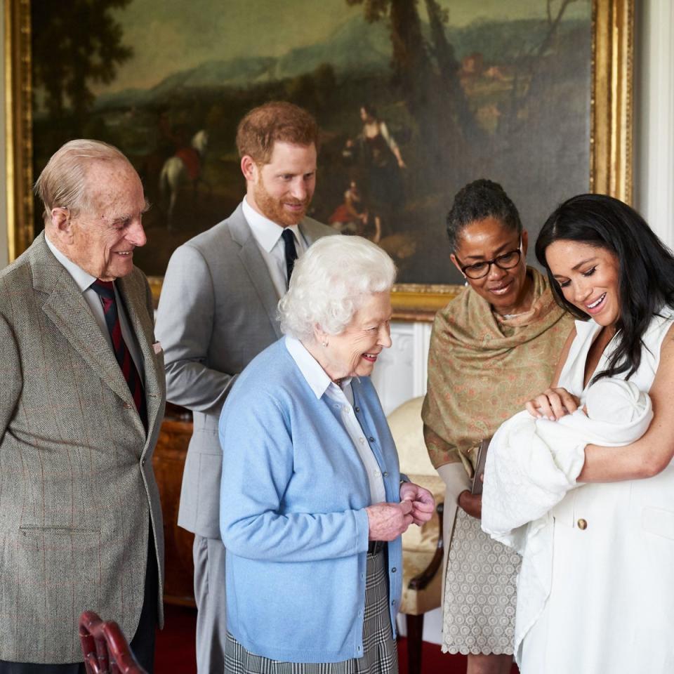 The Duke and Duchess of Sussex are joined by her mother, Doria Ragland, as they show their new son, Archie Harrison Mountbatten-Windsor, to the Queen Elizabeth II and the Duke of Edinburgh at Windsor Castle in May, 2019 (PA)