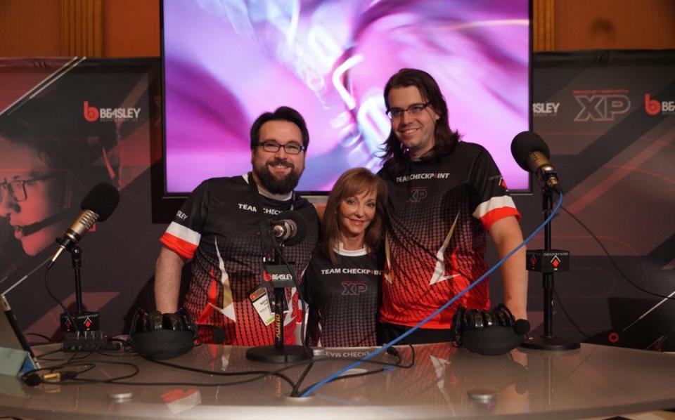 From left to right, Caroline Beasley, CEO of the Beasley Broadcast Group, poses for a photo with Nate Bender and Joe Sloan, co-hosts of the Checkpoint radio show for gamers.