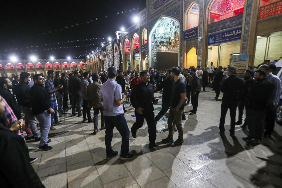 This photo provided by Iranian Students' News Agency, ISNA, shows people at Shah Cheragh shrine, the scene of a gunman attack in the southern city of Shiraz, Iran, Sunday, Aug. 13, 2023. A gunman opened fire Sunday night at a prominent shrine in southern Iran, wounding at least four people, authorities said. Information on the attack at Shah Cheragh remained unclear immediately after the shooting, with state media and semiofficial news agencies offering differing details. (Mohammadreza Dehdari, ISNA via AP)