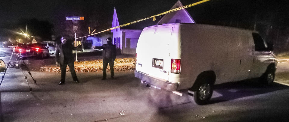 GBI agents and Clayton County police officers continue their investigation Wednesday, Dec. 1, 2021, into a shooting that occurred in Clayton County, south of Atlanta. Four people are dead, including a police officer, after officers responded to a domestic disturbance call Tuesday. (John Spink /Atlanta Journal-Constitution via AP)