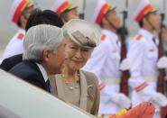 Japan's Empress Michiko looks at Emperor Akihito after arriving at Noi Bai airport in Hanoi, Vietnam, Tuesday, Feb. 28, 2017. The royal couple arrived in Hanoi for a goodwill visit where they will meet with the abandoned wives of former Japanese soldiers from World War II. (AP Photo/Hau Dinh)