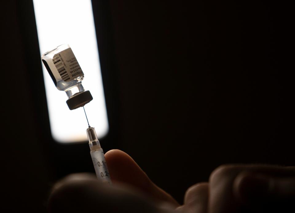 A Pfizer vaccine is drawn out of s vial at the Salem Health COVID-19 vaccination clinic at the Oregon State Fairgrounds in Salem on Feb. 5.