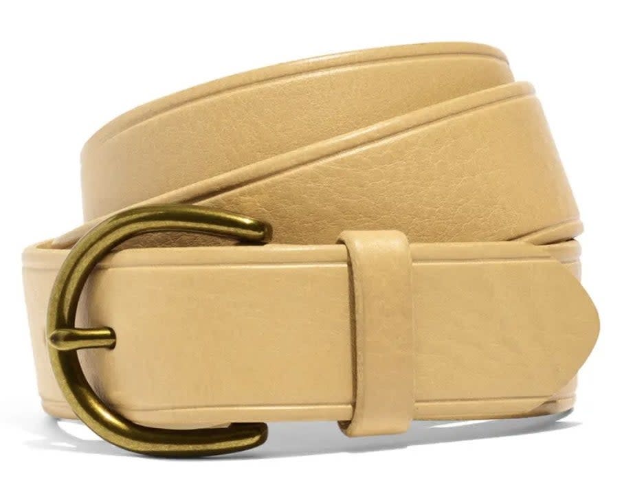 The cream curvy buckle belt rolled up