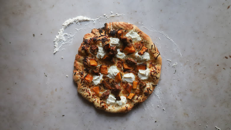 Cooked sausage and pumpkin pizza