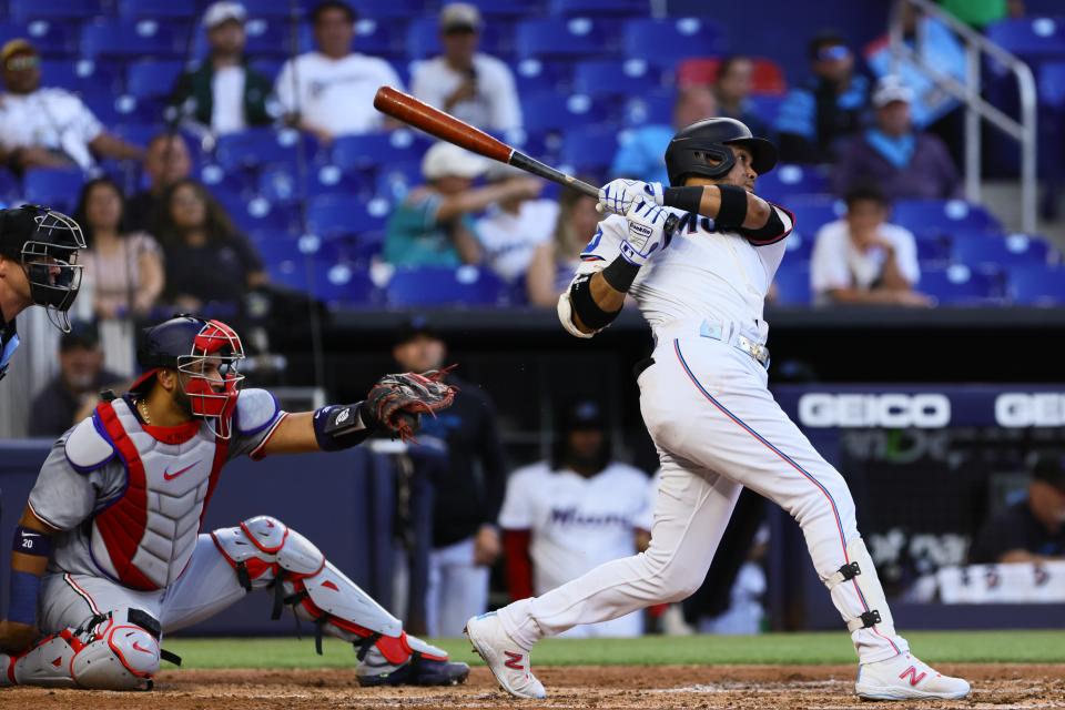 Marlins second baseman Luis Arraez (3) hits a double against the Nationals during the third inning at LoanDepot Park in Miami on April 29, 2024.