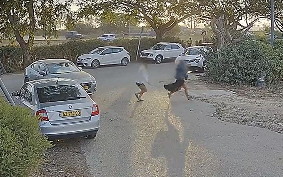 CCTV footage of two women being chased by a Hamas gunman