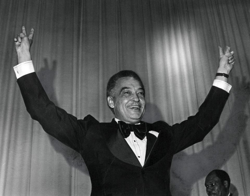 Mayor Coleman Young flashed his victory sign at the inaugural ball at Cobo Hall on Jan. 4, 1974.