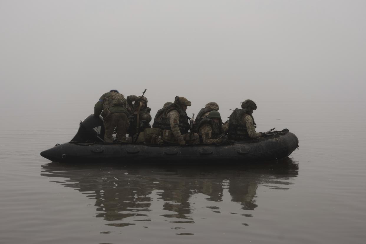 Ukrainian marines sail along the Dnipro River at the front line near Kherson, Ukraine on Oct. 14.