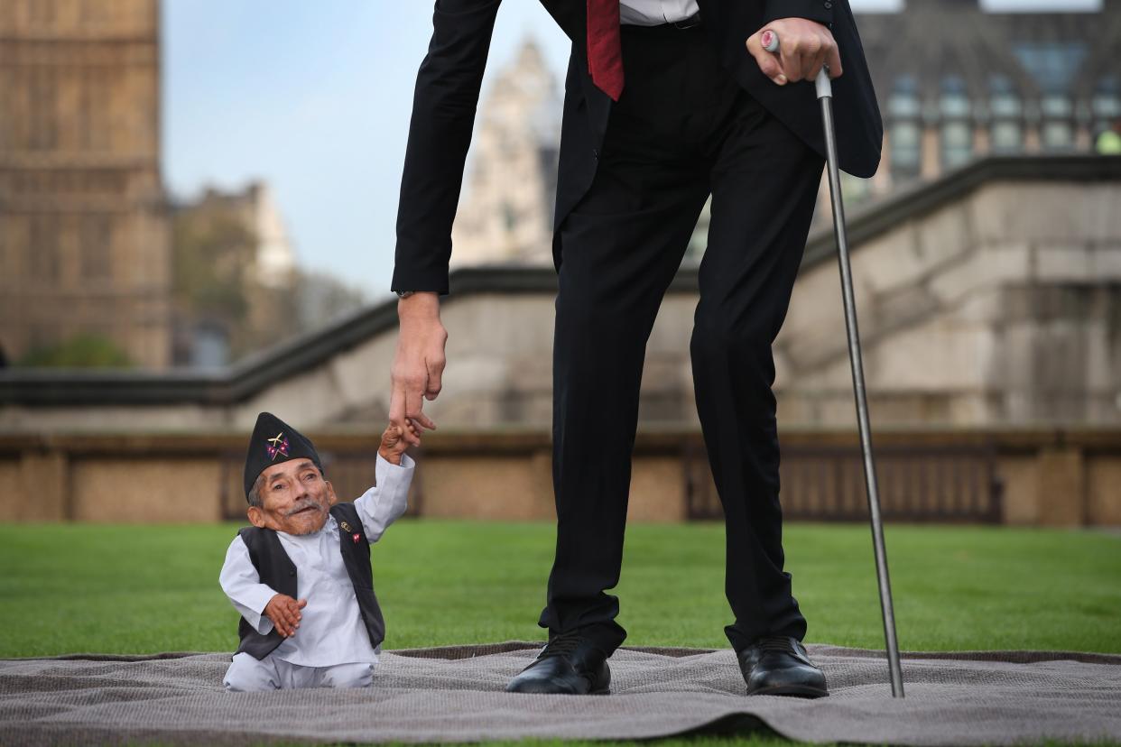 The shortest man ever, Chandra Bahadur Dangi, meets the world's tallest man, Sultan Kosen.