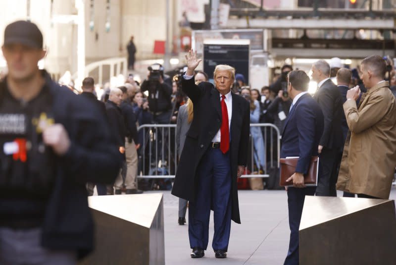 Former President Donald Trump departs 40 Wall Street after a press conference on the day of a hearing in his hush money criminal case in a New York City court room on Monday. It was announced the same day that Trump's social media platform will begin trading the next day on Tuesday on the NYSE under the label "DJT." Pool Photo by John Angelillo/UPI