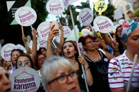 Women rights activists shout slogans during a protest against what they say are violence and animosity they face from men demanding they dress more conservatively, in Istanbul, Turkey, July 29, 2017. REUTERS/Murad Sezer