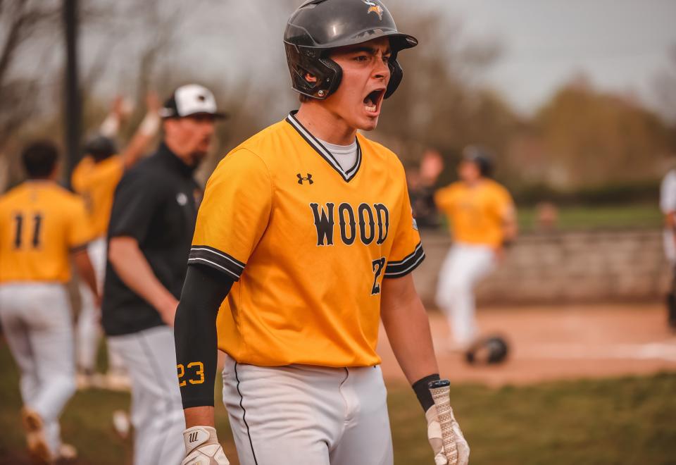 Senior Brian Klumpp exults during an Archbishop Wood game.