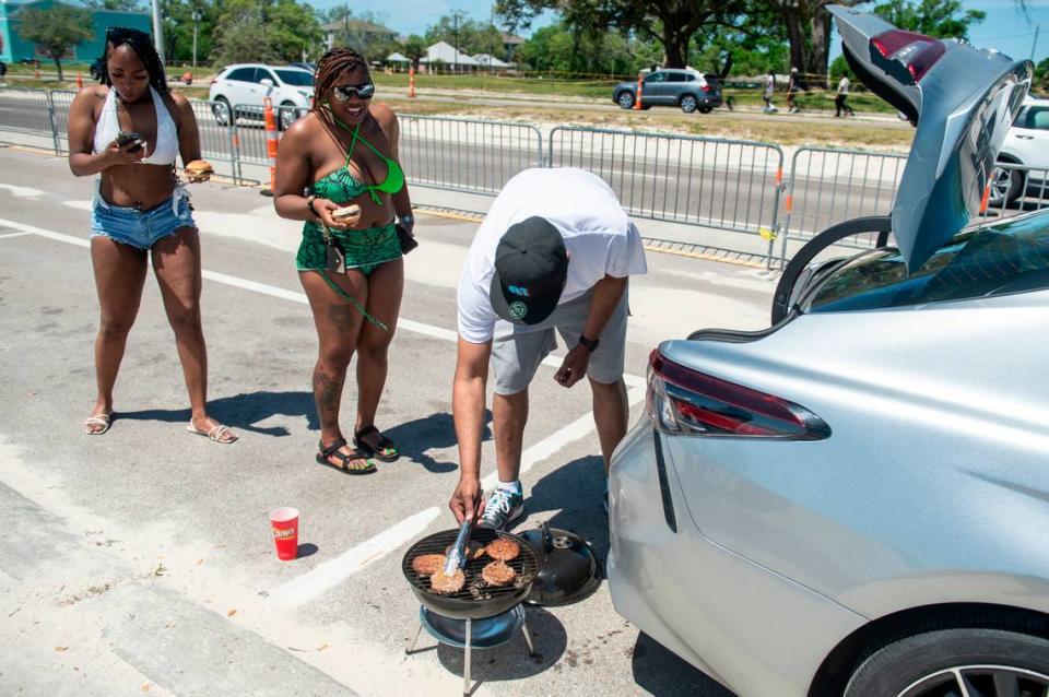 Spring breakers grill burgers next to Biloxi Beach during Black Spring Break on Saturday, April 13, 2024.