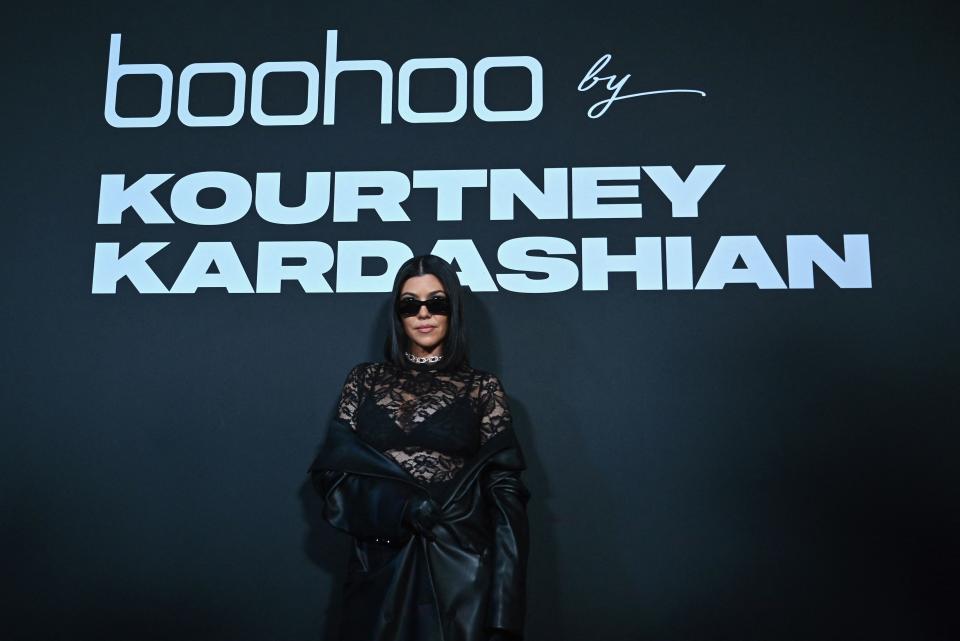 Kourtney Kardashian poses on the runway at the Boohoo by Kourtney Kardashian show during New York Fashion Week on September 13, 2022 in New York city. (Photo by ANGELA WEISS / AFP) (Photo by ANGELA WEISS/AFP via Getty Images)