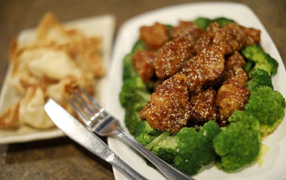 Crab Rangoon with sesame chicken and fresh steamed broccoli at Beijing House in Norwell.