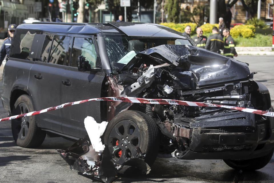 The damaged car of Lazio's soccer player Ciro Immobile lies by the road after crashing, in Rome Sunday, April 16, 2023. Lazio captain Ciro Immobile remains in hospital under observation after his car collided with a tram. Immobile was in the car with his family on Sunday morning when it was involved in a collision with a tram in Rome. (Roberto Monaldo/LaPresse via AP)