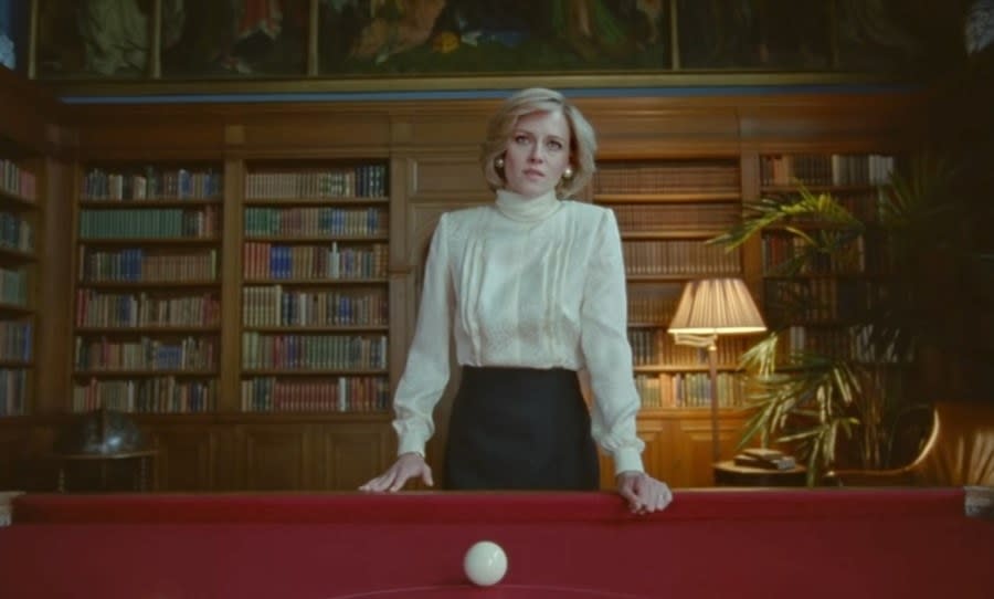 Diana standing in front of the billiards table