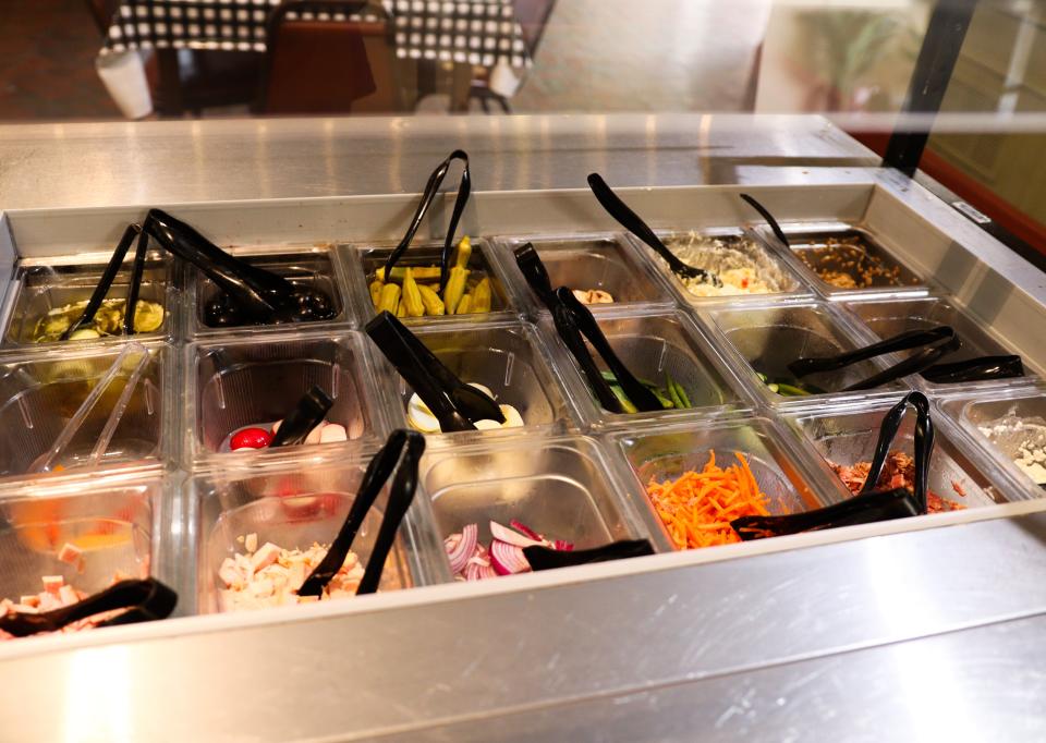 The salad bar at Bambino’s Downtown Bistro offers a variety of fresh veggies and meats.