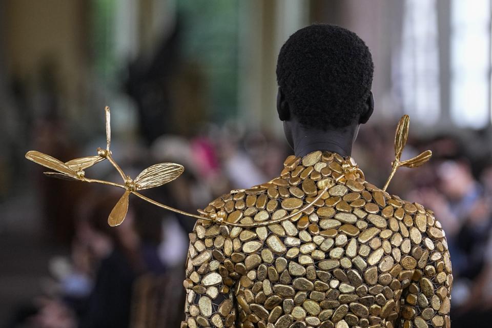 A model wears a creation for the Schiaparelli Haute Couture Fall/Winter 2023-2024 fashion collection presented in Paris, Monday, July 3, 2023. (AP Photo/Michel Euler)