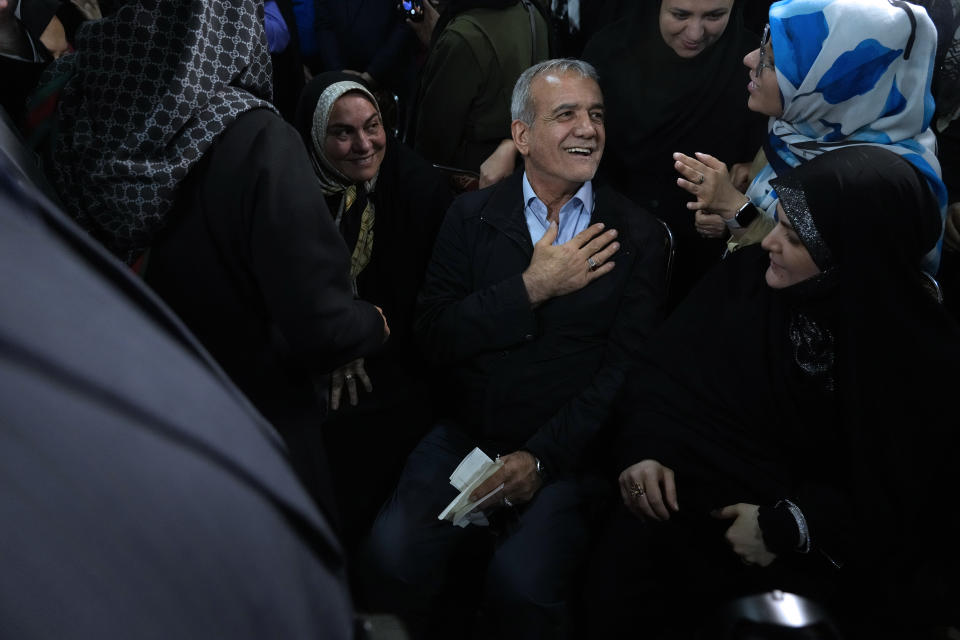 Reformist candidate for Iran's June 28, presidential election Masoud Pezeshkian greets his supporters, during a campaign rally in Tehran, Iran, Friday, June 14, 2024. (AP Photo/Vahid Salemi)