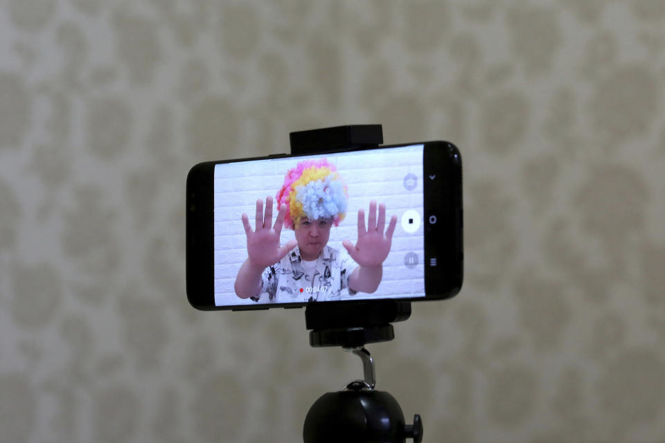 In this July 18, 2019, photo, a smartphone screen shows North Korean refugee Jang Myung-jin as he films himself in a demonstration of his YouTube broadcast during an interview at his house in Seoul, South Korea. The 32-year-old Jang is among a handful of young North Korean refugees in South Korea who have launched YouTube channels that offer a rare glimpse into the everyday lives of people in North Korea, one of the world’s most secretive and repressive countries. (AP Photo/Ahn Young-joon)